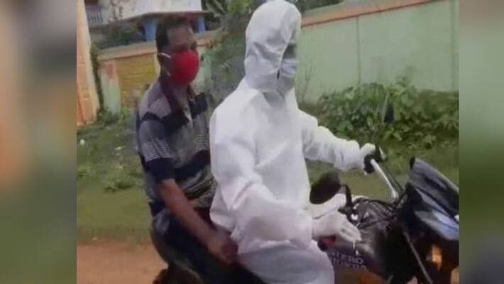 President of TMC youth wing himself takes a patient to hospital, wearing PPE kits in Jhargram BTG President of TMC youth wing himself takes a patient to hospital, wearing PPE kits in Jhargram BTG