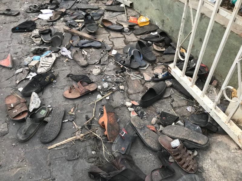 Dozens of slippers on the station premises show the hurry with which the mob tried to escape after police opened fire
