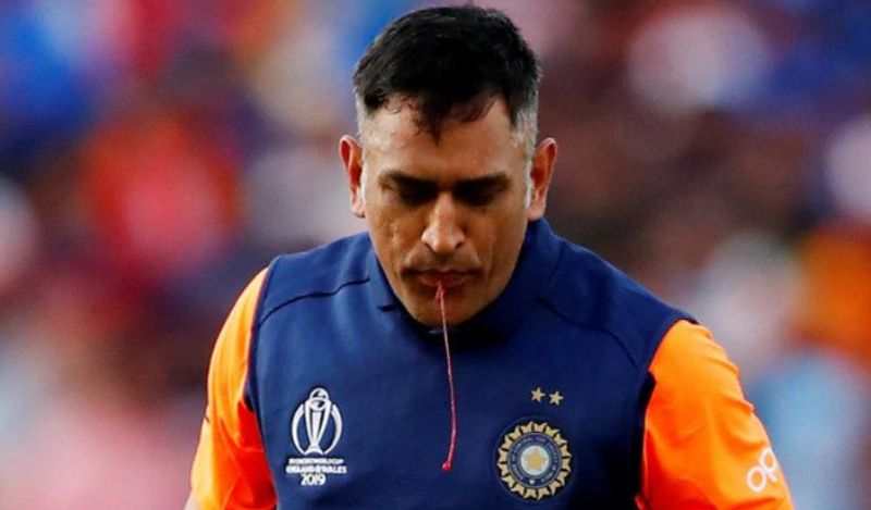 mahendra singh dhoni viral photo of spitting blood on cricket ground goes viral kph
