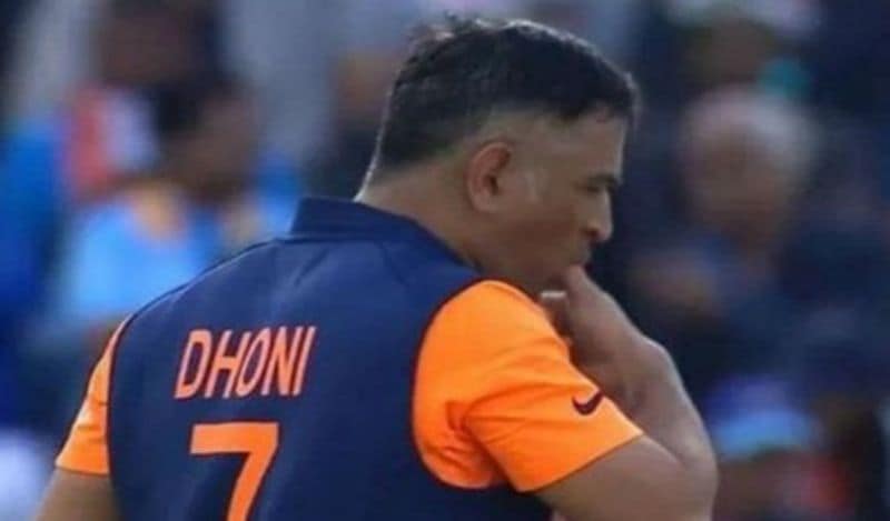 mahendra singh dhoni viral photo of spitting blood on cricket ground goes viral kph