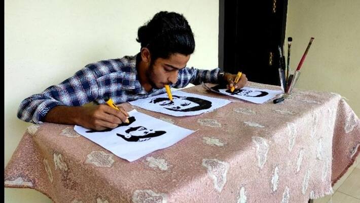 Muhammed Rasal draws three paintings at a time with hand leg and mouth Muhammed Rasal draws three paintings at a time with hand leg and mouth