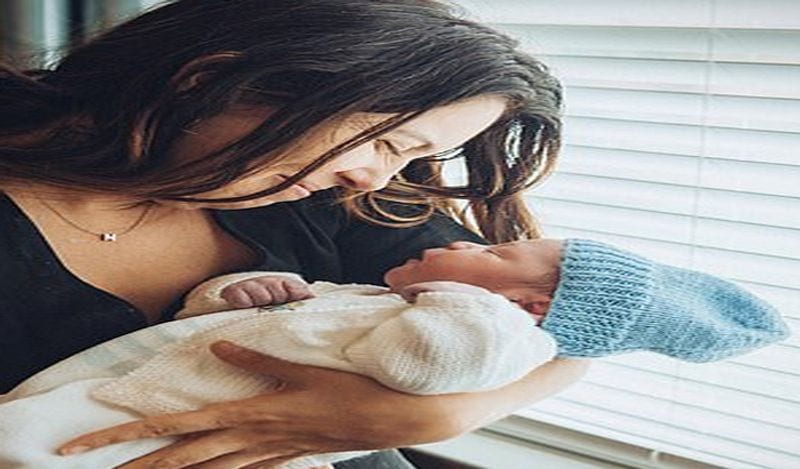 emotional photos of surrogate child birth infront of two fathers goes viral kph