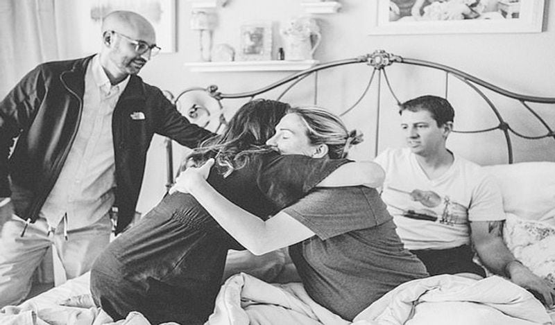 emotional photos of surrogate child birth infront of two fathers goes viral kph