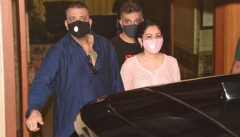 Actor Sanjay Dutt shows a thumbs-up sign as he leaves from his residence for Kokilaben hospital in Mumbai