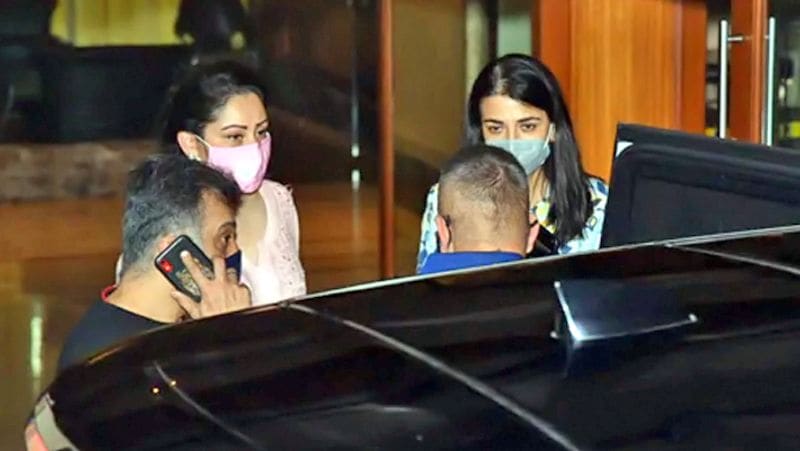 Actor Sanjay Dutt shows a thumbs-up sign as he leaves from his residence for Kokilaben hospital in Mumbai