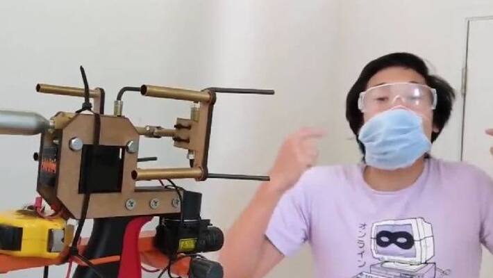 Man makes machine that puts masks on people s faces Man makes machine that puts masks on people s faces