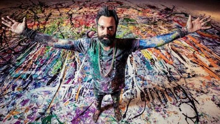 british artist sacha jafri working on 1980 square meter painting british artist sacha jafri working on 1980 square meter painting