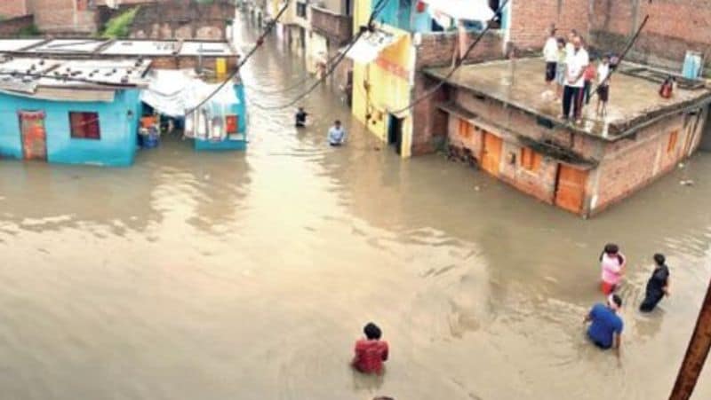 madhya pradesh heavy rain 100 year record broken in indore 12 inches rain in 24 hours floods in river kpr