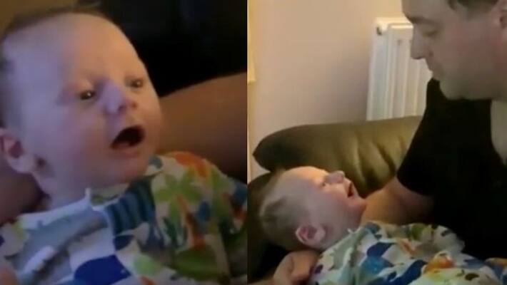 eight week old boy talking to his dad eight week old boy talking to his dad