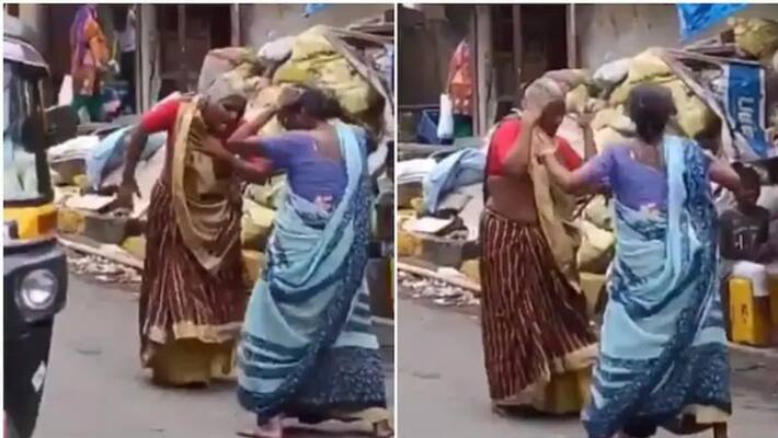 Two elderly women dance to Asha Bhosle's hit song on a street Two elderly women dance to Asha Bhosle's hit song on a street