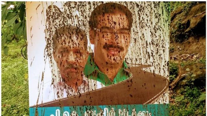 Cow dung paint on MLA's Flex board Cow dung paint on MLA's Flex board