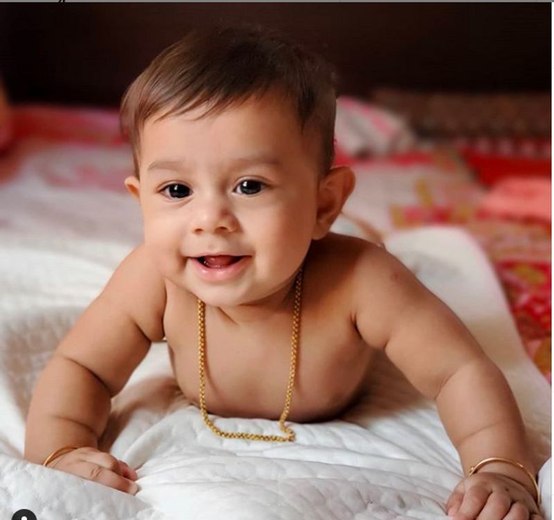 actress radhika pandit shares son yatharvs cute pic calls him prince as he turns 11 month
