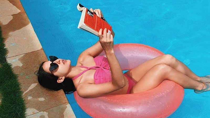 saif ali khan's daughter sara ali khan reading book in swimming pool wearing pink bikini KPJ