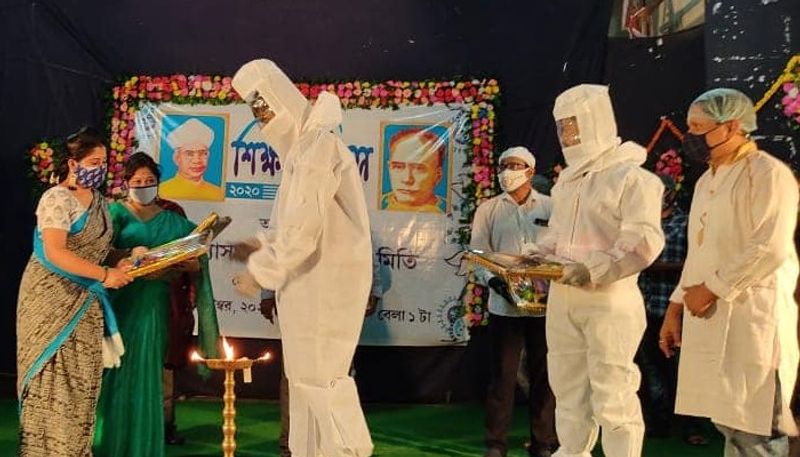 Teachers felicitated in teachers day by wearing ppe kit in Midnapore BTD