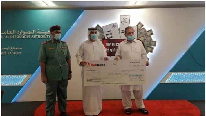 Expat won Dh20,000 after registering car Expat won Dh20,000 after registering car