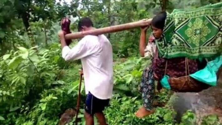 Villagers carry pregnant woman on stretcher for 9 km in AP's Vizianagaram district Villagers carry pregnant woman on stretcher for 9 km in AP's Vizianagaram district