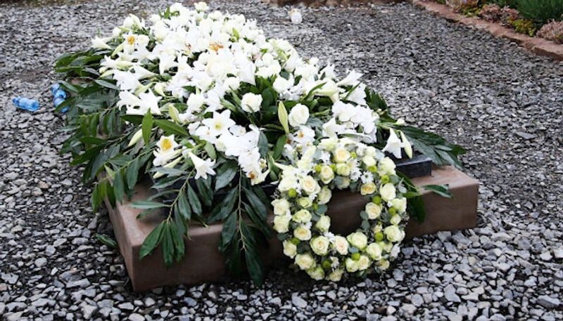 Why do people place flowers on graves-snj