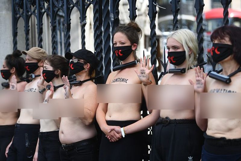 bare chest protest in front of british parliament protest