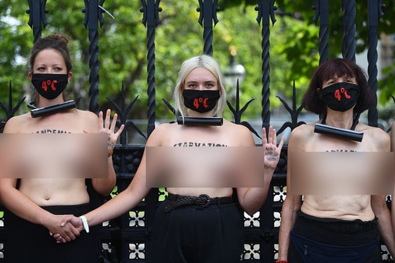 bare chest protest in front of british parliament protest