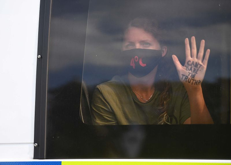 bare chest protest in front of british parliament protest