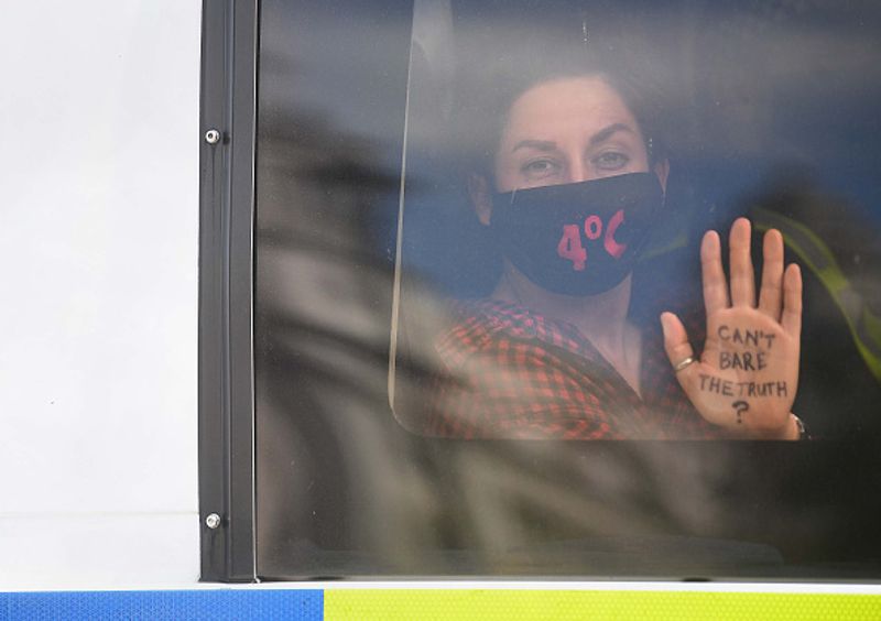 bare chest protest in front of british parliament protest