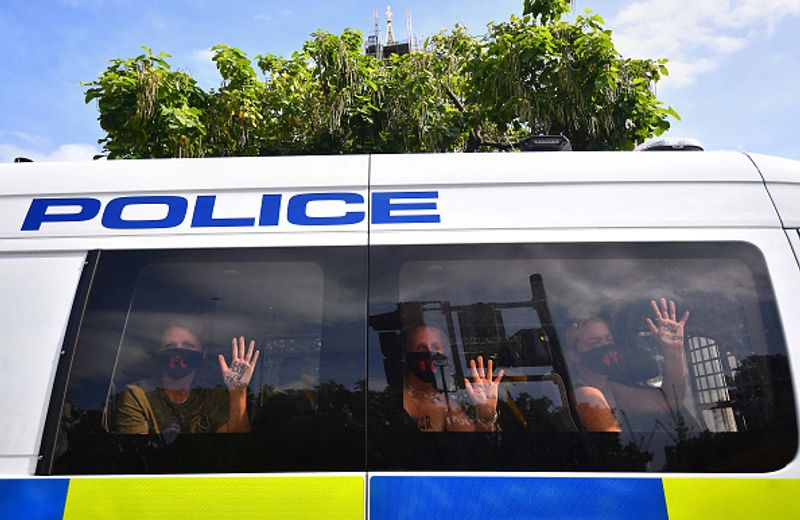 bare chest protest in front of british parliament protest