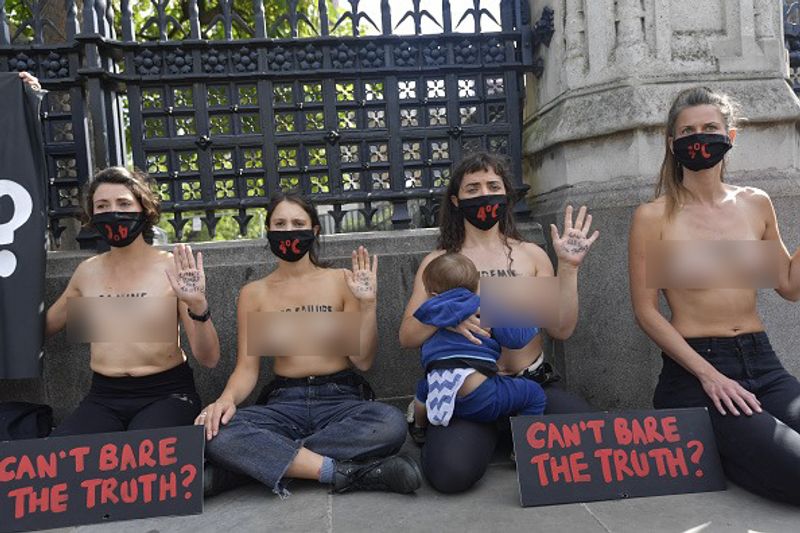 bare chest protest in front of british parliament protest