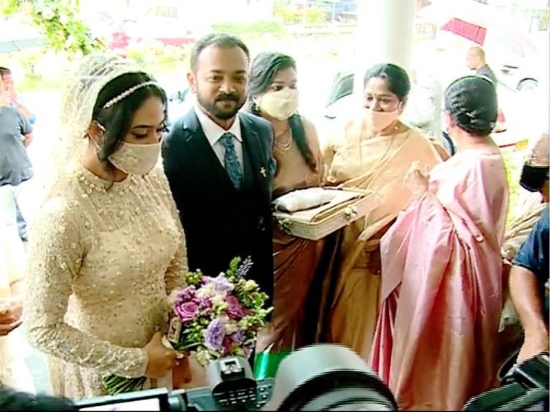 pictures of Miya in wedding dress wearing a mask photos