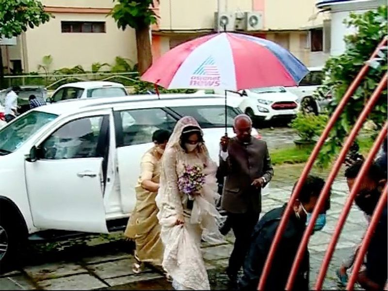pictures of Miya in wedding dress wearing a mask photos