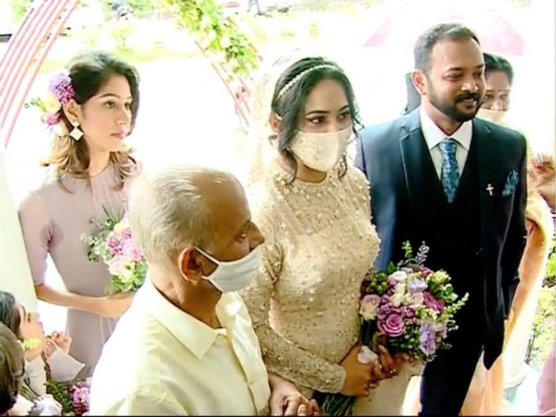 pictures of Miya in wedding dress wearing a mask photos