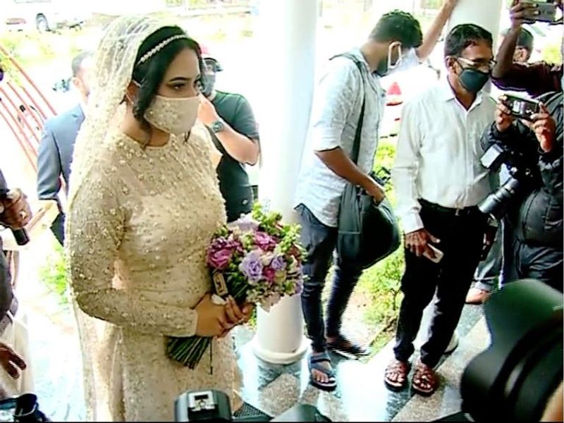 pictures of Miya in wedding dress wearing a mask photos