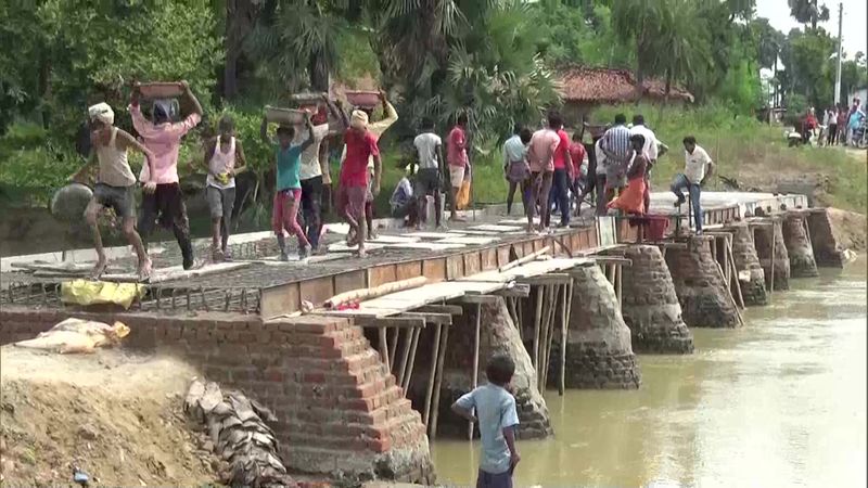 government bridge was washed away by the first rain and another place the villagers built their own bridge in bihar