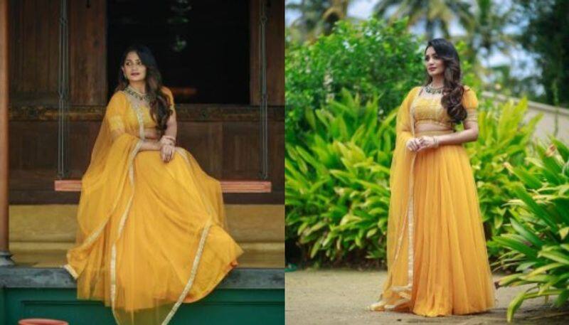 Actress and malayalam acnhor arya babu s new photoshoot images with her new yellowish lehanka choli