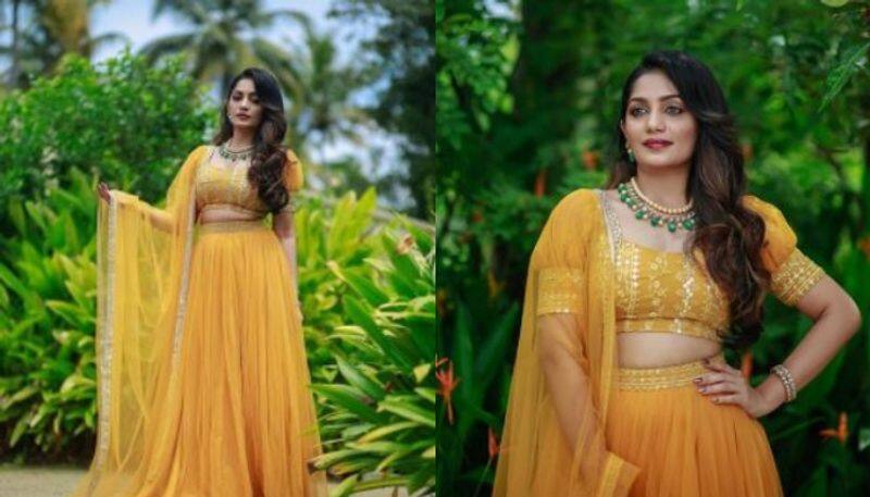 Actress and malayalam acnhor arya babu s new photoshoot images with her new yellowish lehanka choli