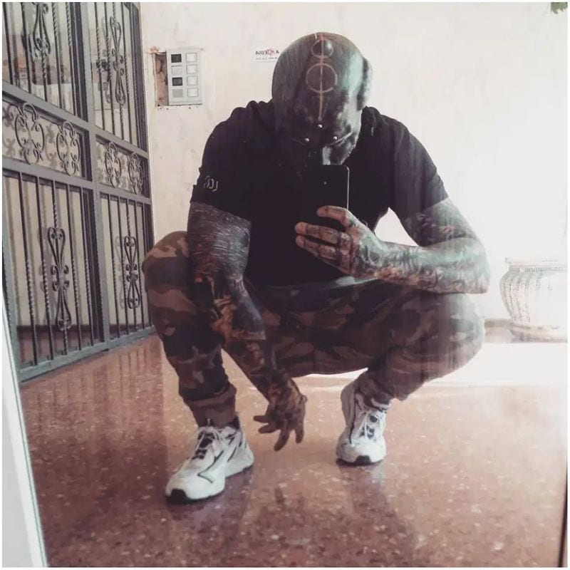 Man transforms himself into black alien by having nose REMOVED