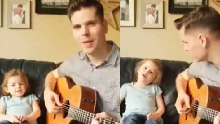 Little girl sings with her father in beautiful home concert Little girl sings with her father in beautiful home concert