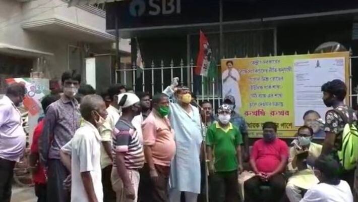 Customers protest the relocation of Behala State Bank branch RTB Customers protest the relocation of Behala State Bank branch RTB