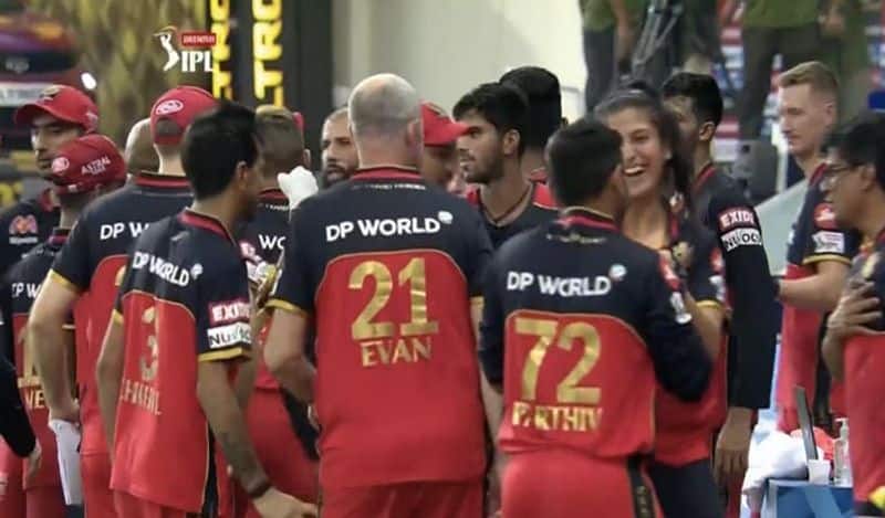 RCB VS MI match...  Who is this mistery girl in rcb jersey