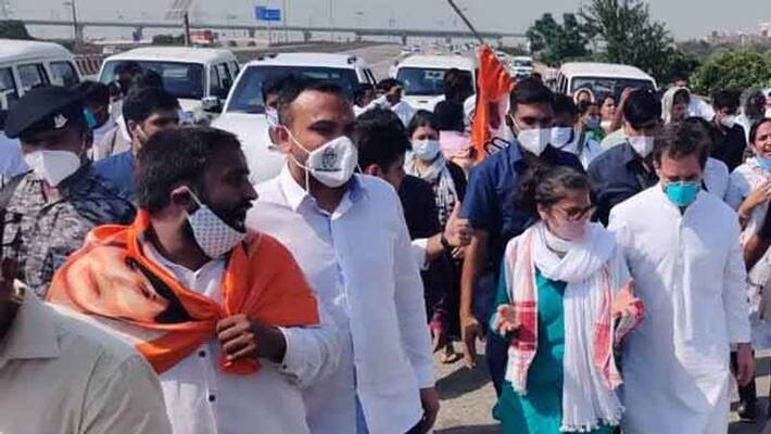 Stopped on their way to Hathras, Rahul, Priyanka march to meet victims family Stopped on their way to Hathras, Rahul, Priyanka march to meet victims family