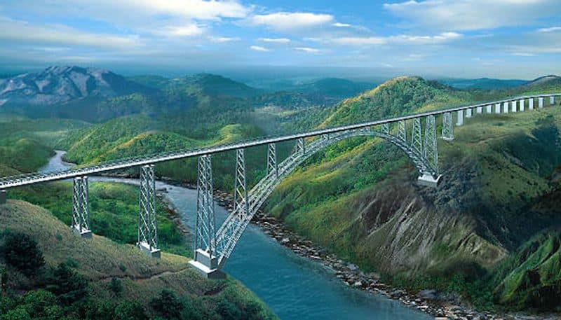 9. World's Highest Rail Bridge in JammuChenab bridge in Jammu and Kashmir is the World's tallest rail bridge with a height of 1,178 feet over the river Chenab. The arch-shaped bridge is said to be 35 metres taller than Eiffel Tower.
