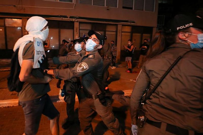New law to curb anti-government protesters Israelis shouting slogans
