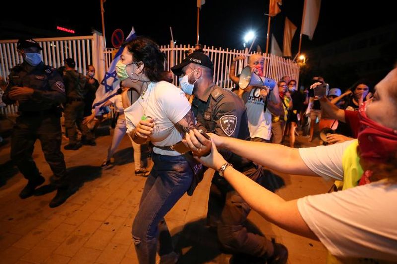 New law to curb anti-government protesters Israelis shouting slogans