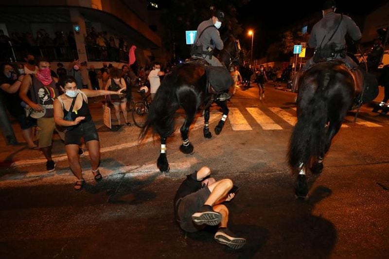 New law to curb anti-government protesters Israelis shouting slogans