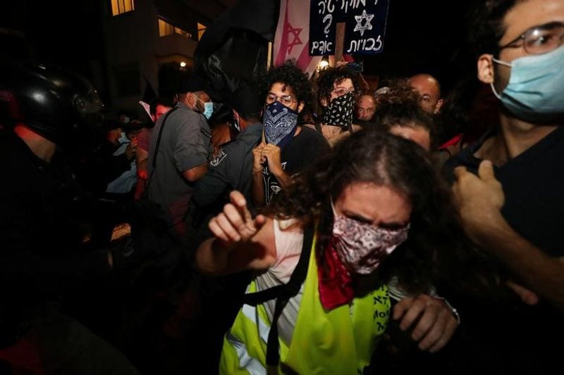 New law to curb anti-government protesters Israelis shouting slogans