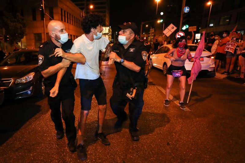 New law to curb anti-government protesters Israelis shouting slogans