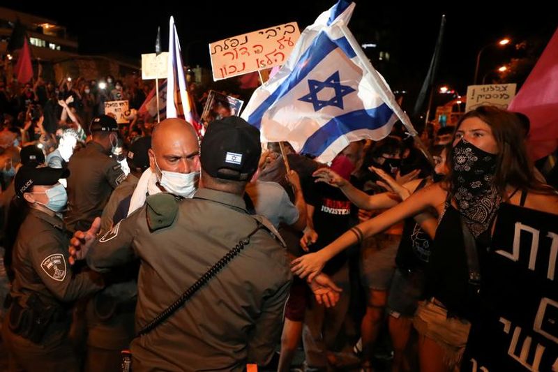 New law to curb anti-government protesters Israelis shouting slogans