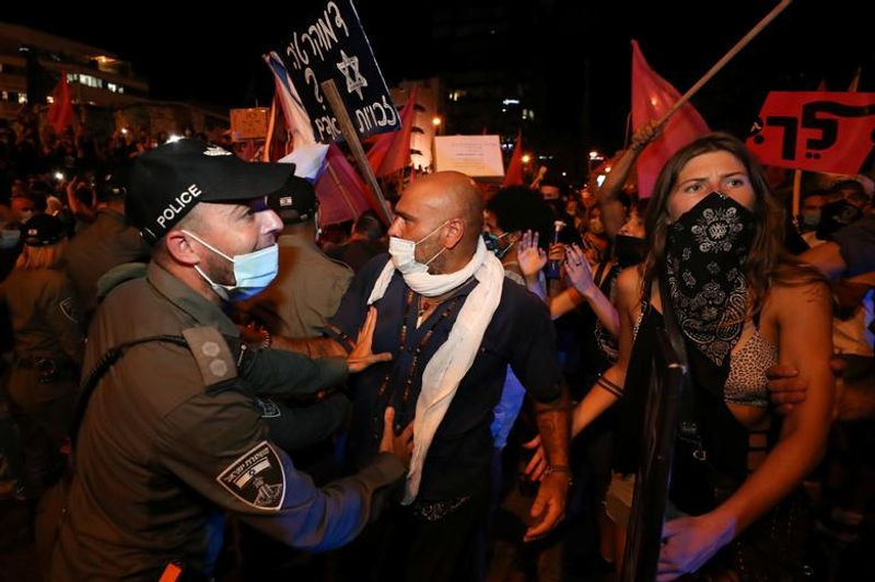 New law to curb anti-government protesters Israelis shouting slogans