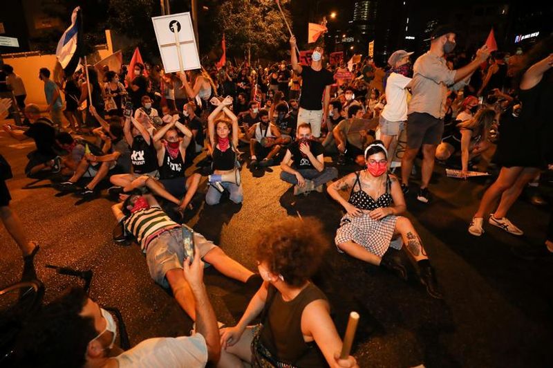 New law to curb anti-government protesters Israelis shouting slogans