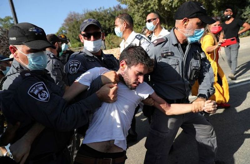 New law to curb anti-government protesters Israelis shouting slogans