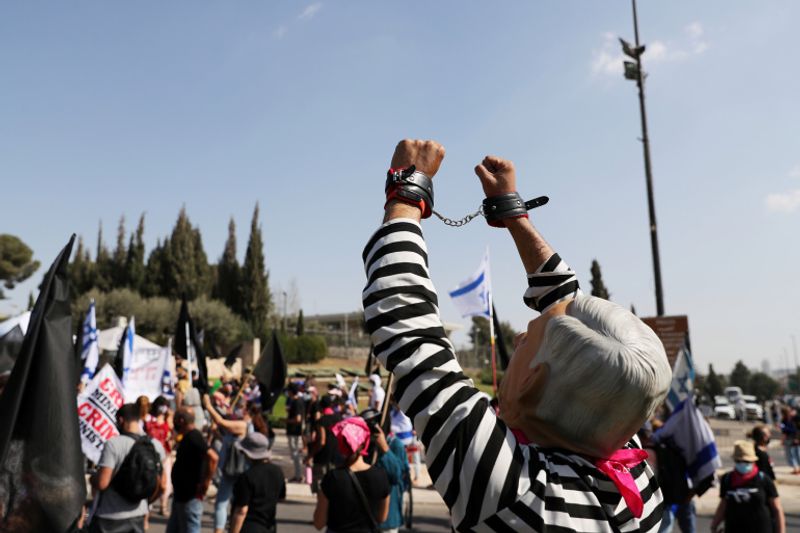 New law to curb anti-government protesters Israelis shouting slogans